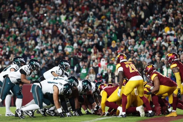 The Washington Commanders defend the Philadelphia Eagles' tush-push play on Saturday, Dec. 20, 2025. (Scott Taetsch/Getty Images)