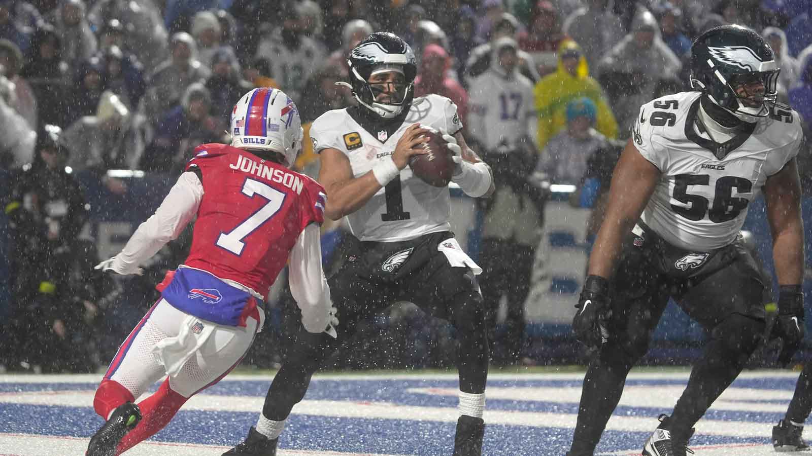 Buffalo Bills cornerback Taron Johnson forces Philadelphia Eagles quarterback Jalen Hurts to scramble away from him during second half action against the Philadelphia Eagles at Highmark Stadium in Orchard Park on Dec. 28, 2025.