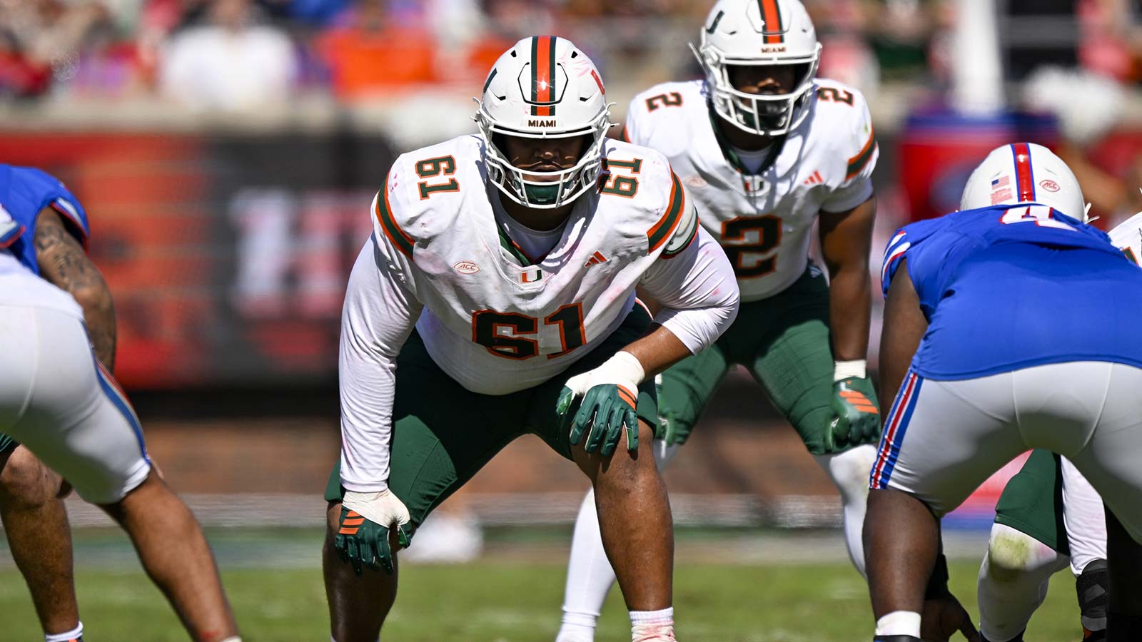 Miami Hurricanes offensive lineman Francis Mauigoa (61) gets into position during the game between the Mustangs and the Hurricanes at Gerald J. Ford Stadium. Mandatory Credit: Jerome Miron-Imagn Images