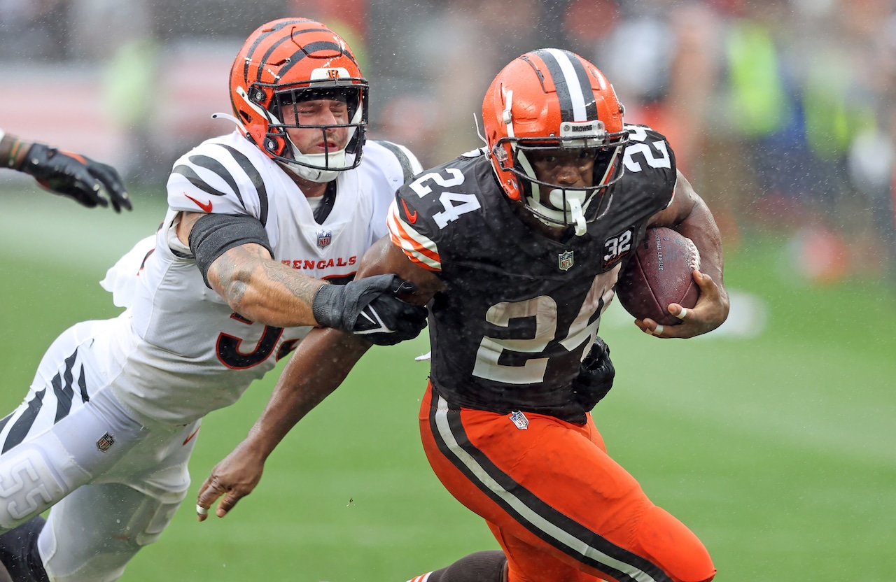 Cleveland Browns running back Nick Chubb evades the grasp of Cincinnati Bengals linebacker Logan Wilson in the second half of play.