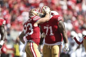Christian McCaffrey #23 of the San Francisco 49ers celebrates with Trent Williams #71 of the San Francisco 49ers after running for a touchdown during an NFL football game between the San Francisco 49ers and the Arizona Cardinals at Levi's Stadium on October 01, 2023 in Santa Clara, California.