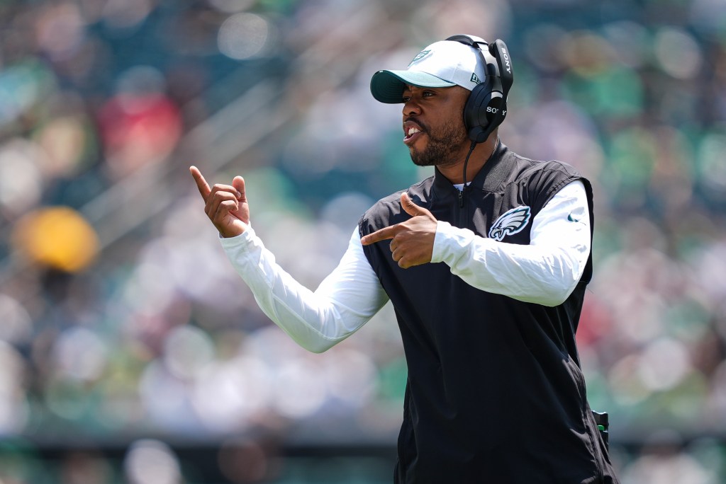 Philadelphia Eagles passing coordinator Christian Parker looks on from the sideline during an NFL preseason football game against the Cleveland Browns at Lincoln Financial Field on August 16, 2025 in Philadelphia, Pennsylvania.