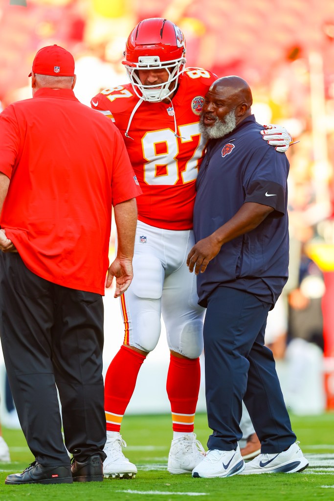 Travis Kelce greets former Chiefs offensive coordinator Eric Bieniemy prior to the NFL Preseason 2025 game between Chicago Bears and Kansas City Chiefs at Arrowhead Stadium on August 22, 2025.