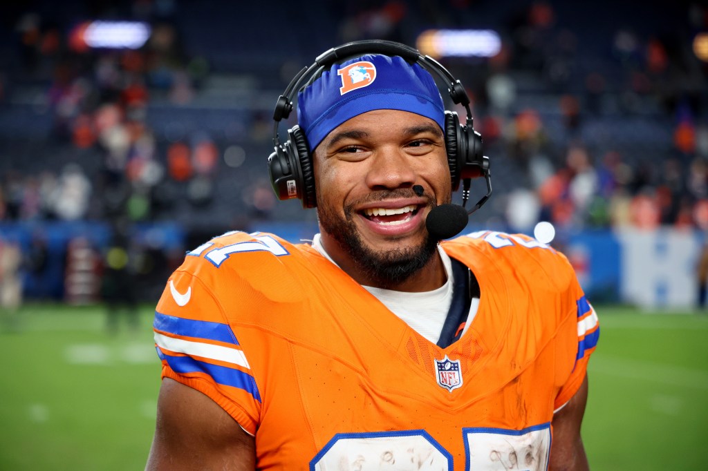 J.K. Dobbins celebrates after defeating the Las Vegas Raiders in the game at Empower Field At Mile High on November 06, 2025 in Denver, Colorado. 