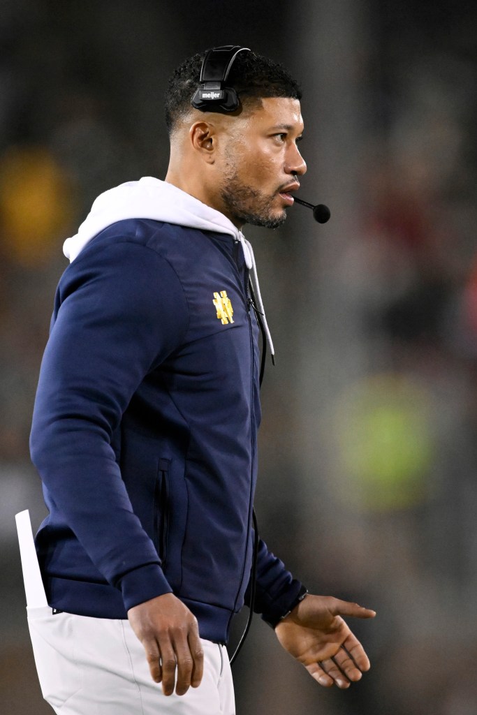 Head coach Marcus Freeman of the Notre Dame Fighting Irish looks on against the Stanford Cardinal in the first quarter at Stanford Stadium on November 29, 2025 in Stanford, California. 