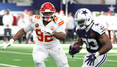 Javonte Williams #33 of the Dallas Cowboys is pursued by Derrick Nnadi #92 of the Kansas City Chiefs during a game at AT&T Stadium on November 27, 2025 in Arlington, Texas.