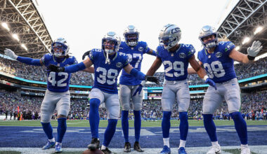 SEATTLE, WASHINGTON - NOVEMBER 30: Ty Okada #39 of the Seattle Seahawks celebrates with members of the defense after his fumble recovery against the Minnesota Vikings in the third quarter of a game at Lumen Field on November 30, 2025 in Seattle, Washington. (Photo by Steph Chambers/Getty Images)