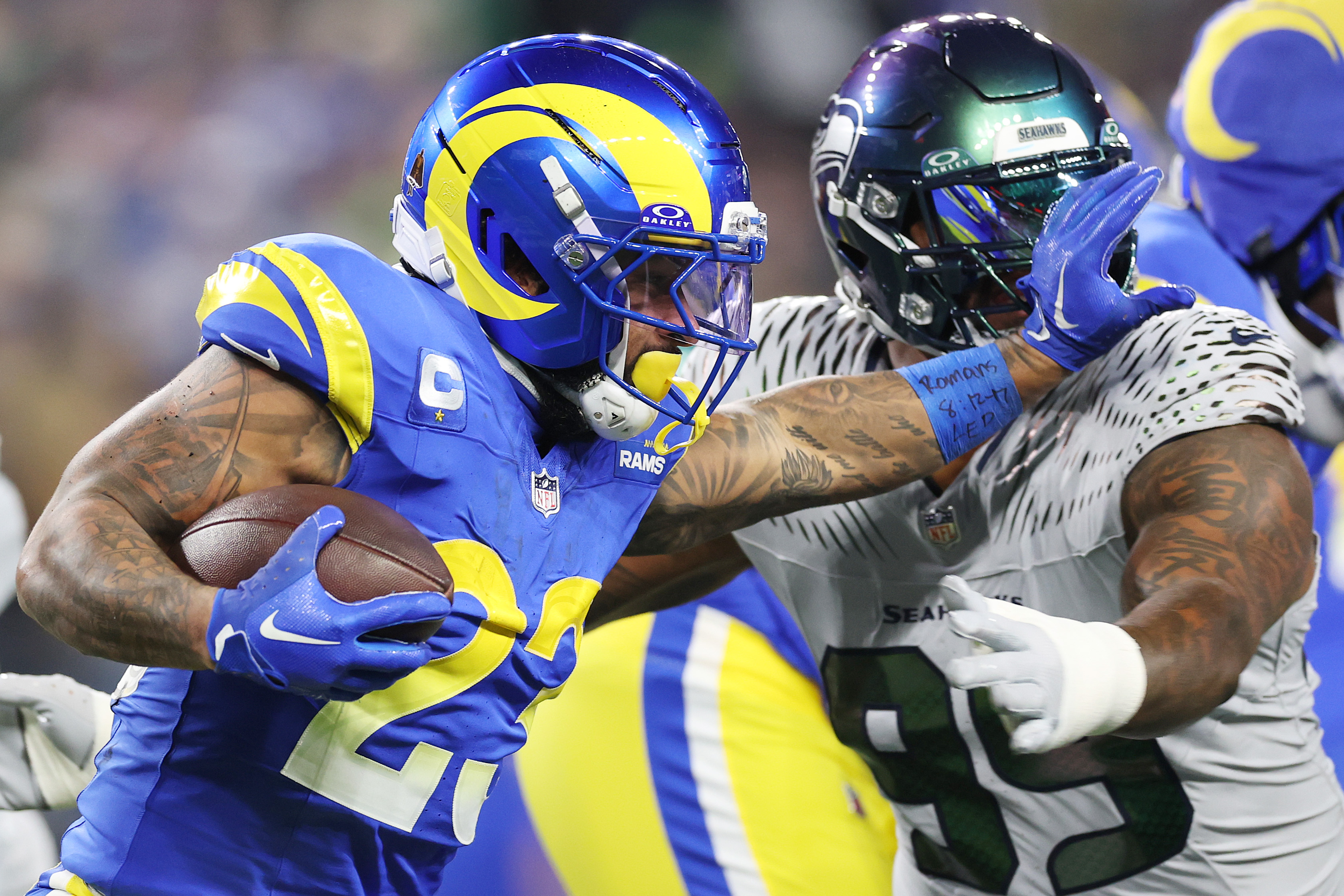 Rams running back Kyren Williams runs with the ball as...