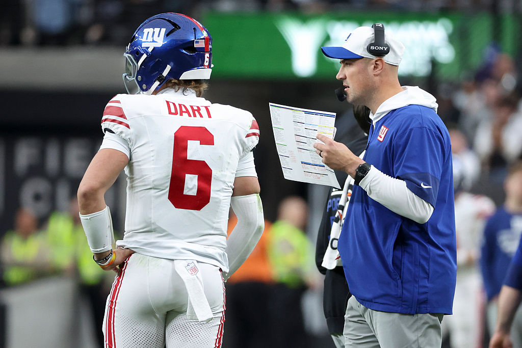 LAS VEGAS, NEVADA - DECEMBER 28: Jaxson Dart #6 and interim head coach Mike Kafka of the New York Giants talk in the second quarter of a game against the Las Vegas Raiders at Allegiant Stadium on December 28, 2025 in Las Vegas, Nevada. (Photo by Ian Maule/Getty Images)