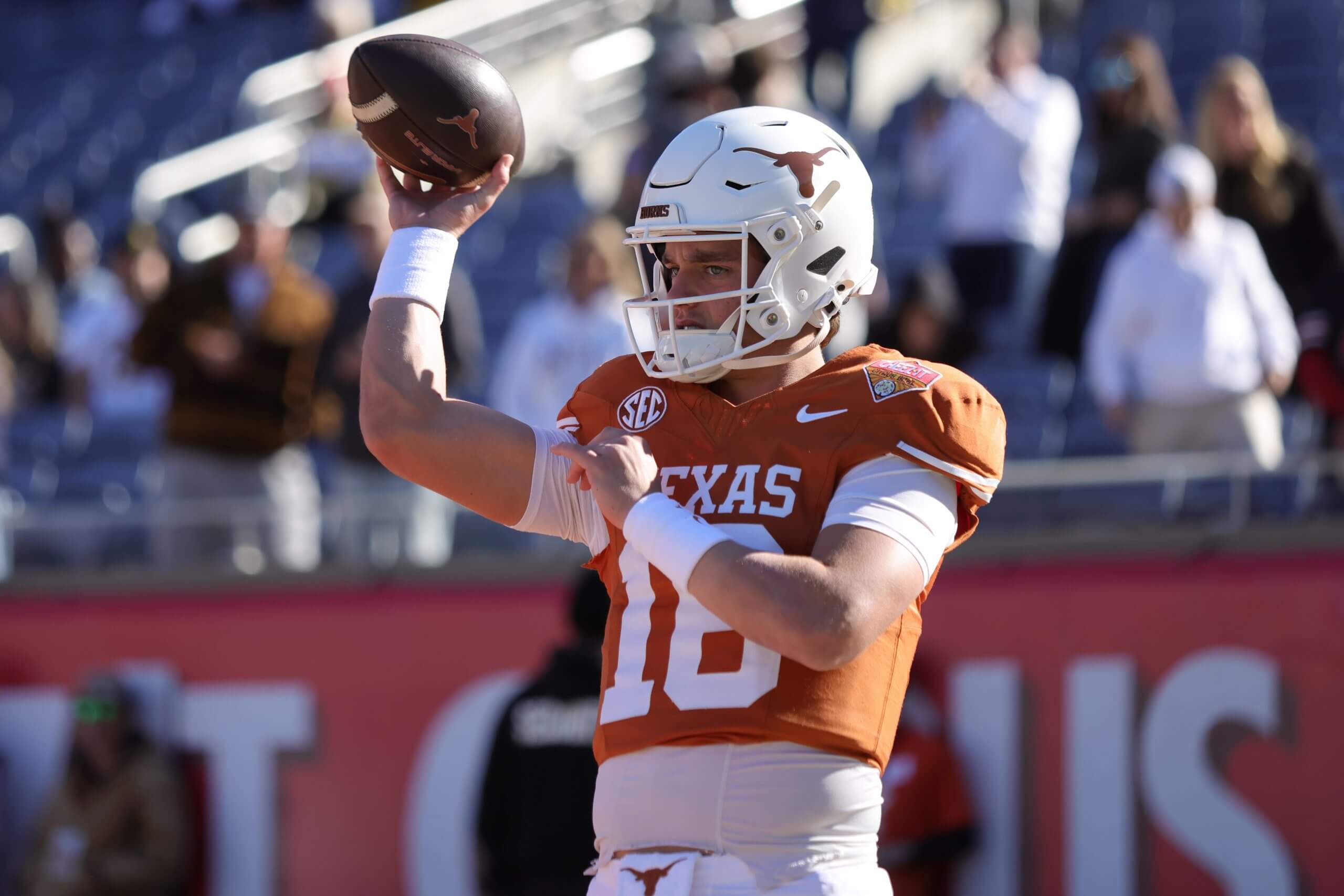 Texas quarterback Arch Manning throws the ball during warmups
