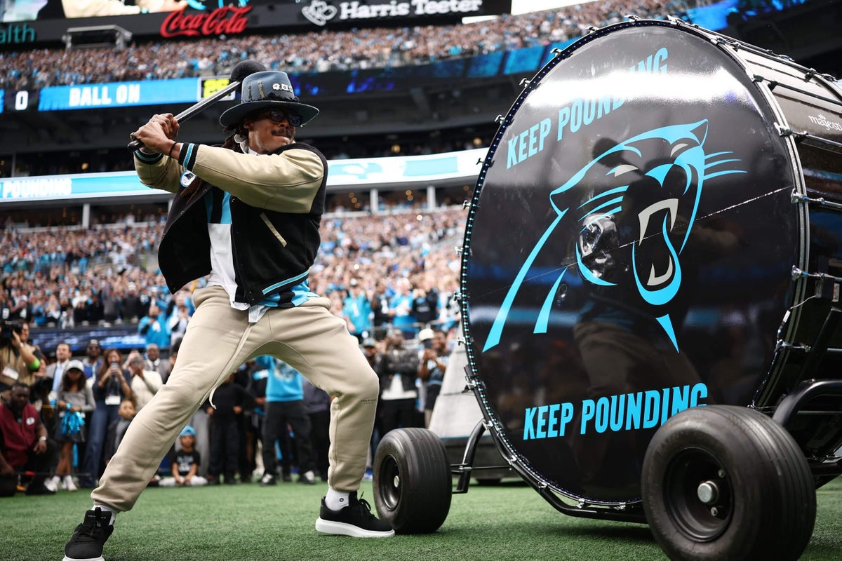 Cam Newton returns, gets Panthers-Rams started by pounding the drum