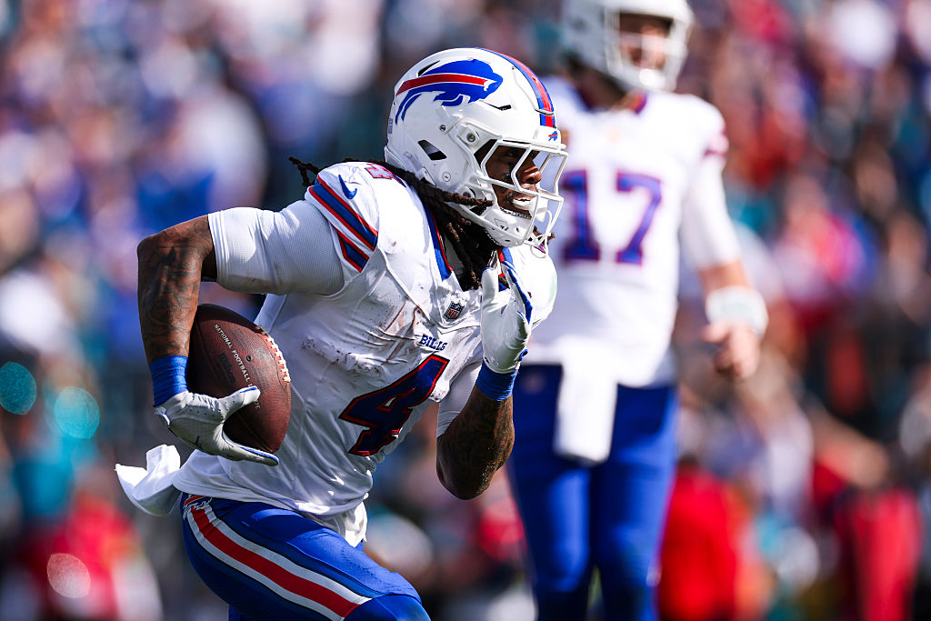 JACKSONVILLE, FLORIDA - JANUARY 11: James Cook III #4 of the Buffalo Bills runs the ball during the second quarter of an NFL wild card playoff game against the Jacksonville Jaguars at Everbank Stadium on January 11, 2026 in Jacksonville, Florida. (Photo by Logan Bowles/Getty Images)