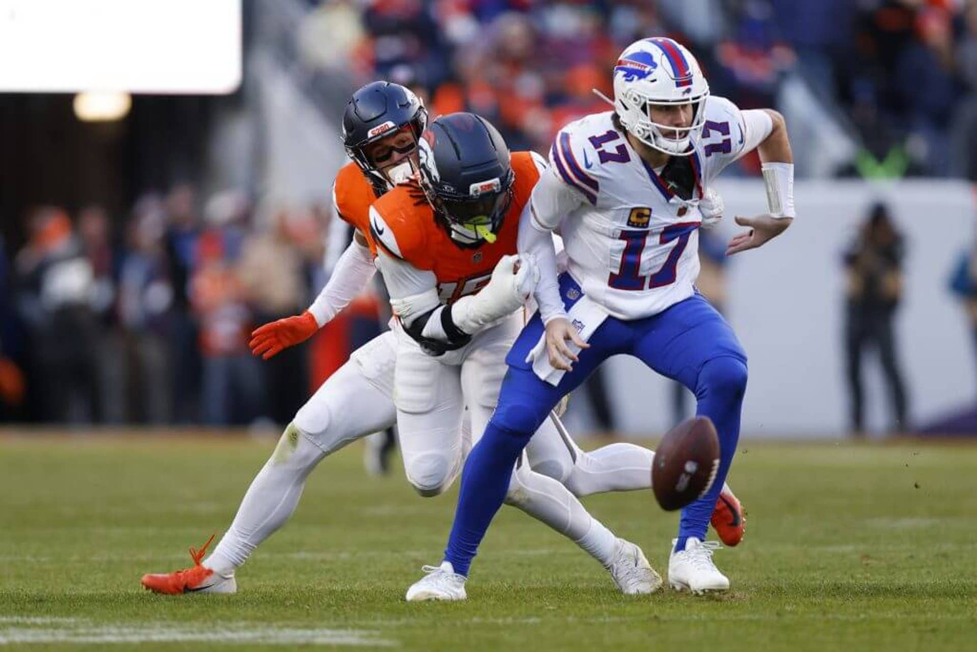 Josh Allen of the Buffalo Bills fumbles the ball against the Denver Broncos during the AFC Divisional Playoff game on Jan. 17 in Denver.