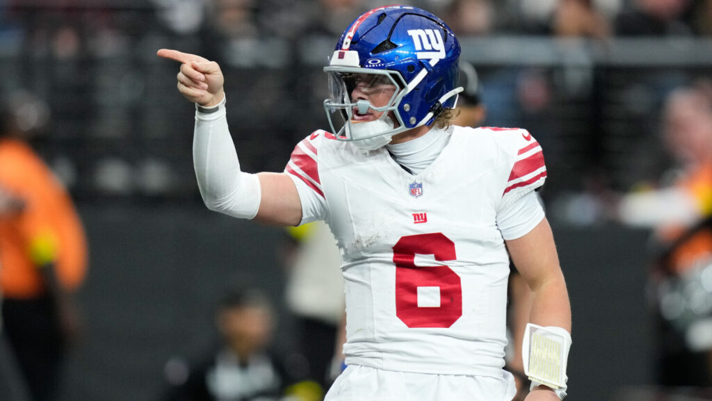 New York Giants quarterback Jaxson Dart celebrates his touchdown during the first half of an NFL football game against the Las Vegas Raiders Sunday, Dec. 28, 2025, in Las Vegas.