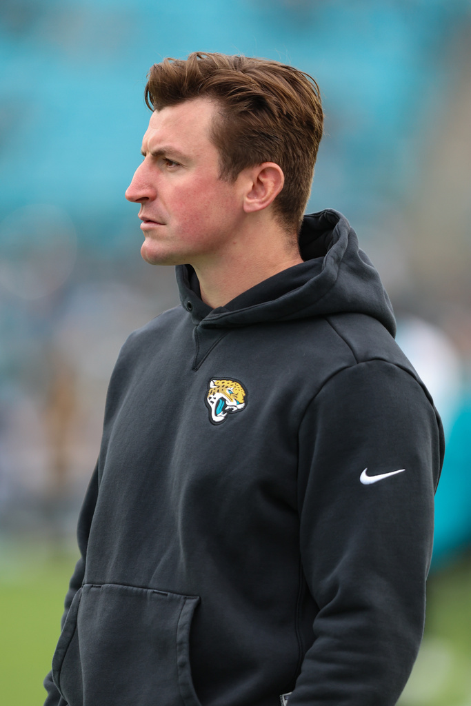 Jacksonville Jaguars offensive coordinator Grant Udinski warms up before an NFL football game against the Tennessee Titans, Sunday, Jan. 4, 2026, in Jacksonville, Fla. The Jaguars defeated the Titans 41-7. 