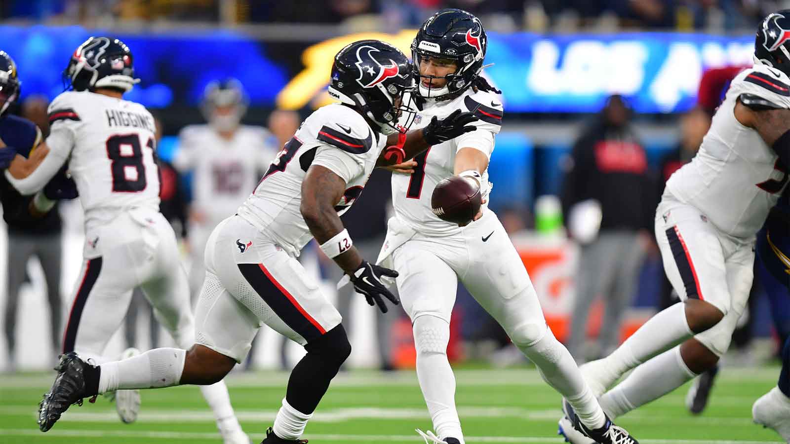 Houston Texans running back Woody Marks (27) takes the hand off from quarterback C.J. Stroud (7)