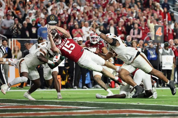 Indiana quarterback Fernando Mendoza dives across the goal line for a touchdown during the Hoosiers' 27-21 victory over the Miami Hurricanes for the college football national championship on Jan. 19, 2026. (Carmen Mandato / Getty Images)