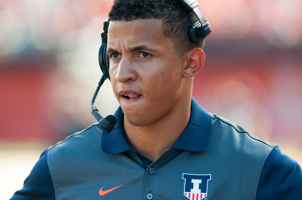 Former Illinois quarterback and current running backs coach Nathan Scheelhaase watches from the sidelines during an NCAA football game against Middle Tennessee Saturday, Sept. 26, 2015 at Memorial Stadium in Champaign, Ill.  Illinois won 27-25. 