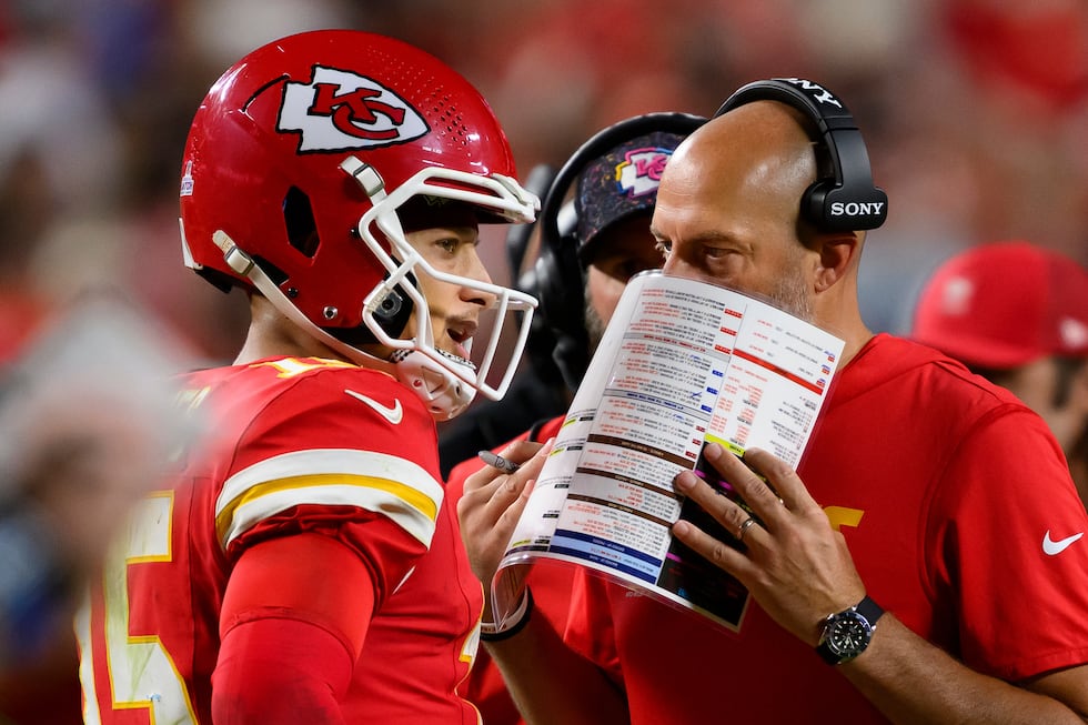 Kansas City Chiefs offensive coordinator Matt Nagy, right, talks to Chiefs quarterback Patrick...