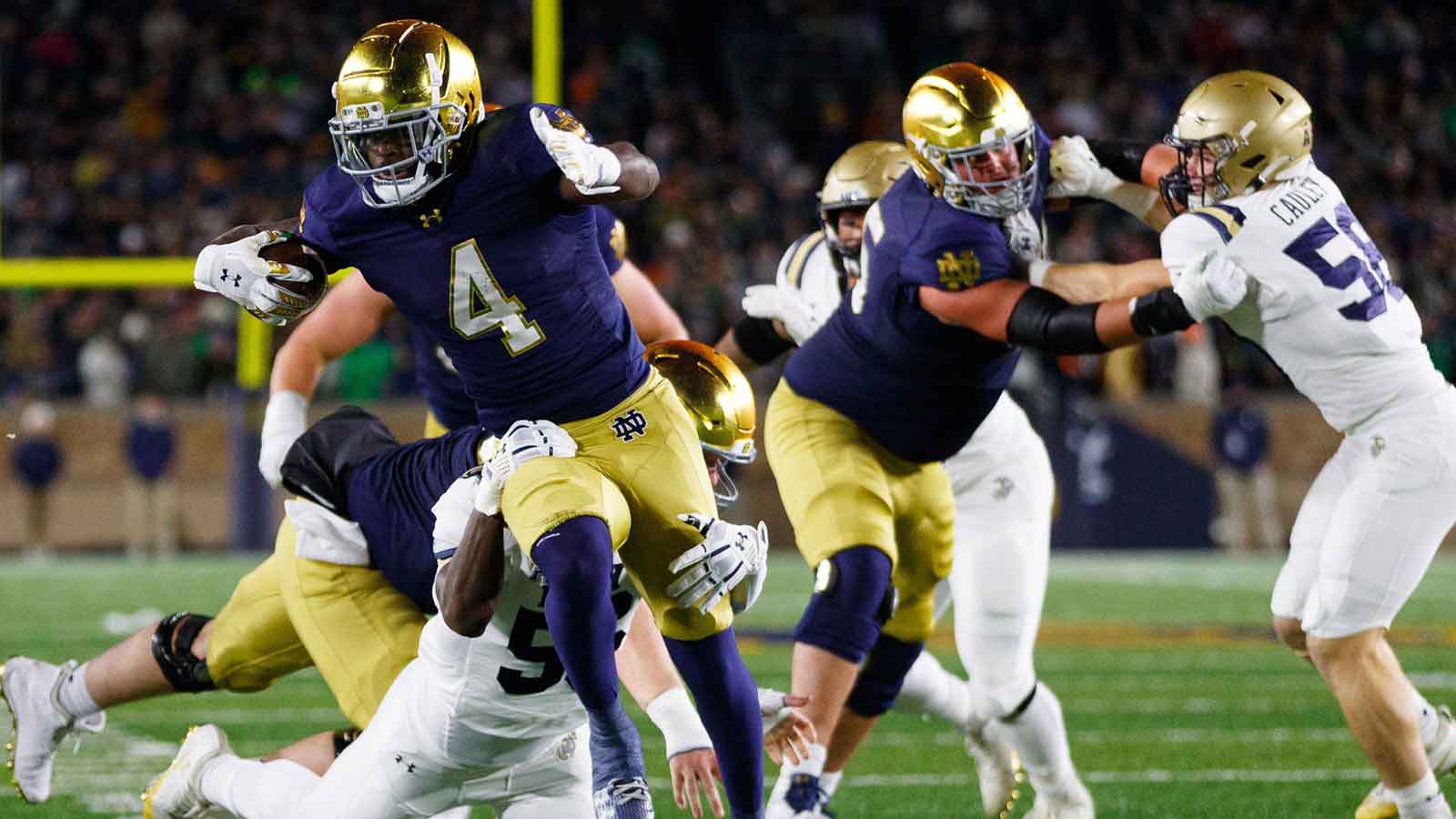 Notre Dame running back Jeremiyah Love (4) runs with the ball during the first half of a NCAA football game against Navy at Notre Dame Stadium on Saturday, Nov. 8, 2025, in South Bend.