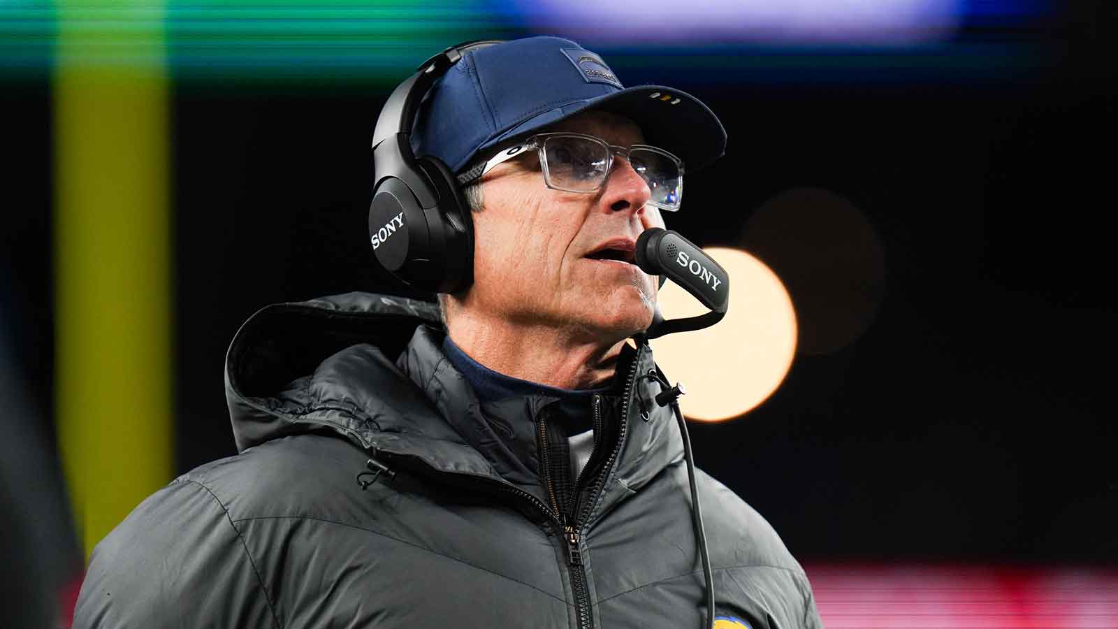 Los Angeles Chargers head coach Jim Harbaugh looks on during the second quarter against the New England Patriots in an AFC Wild Card Round game at Gillette Stadium. 