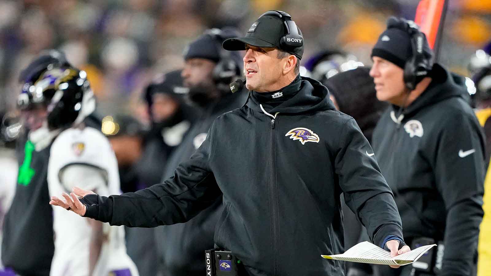 Baltimore Ravens head coach John Harbaugh reacts to a play during the first quarter against the Green Bay Packers at Lambeau Field.