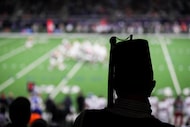 A Shriner watches from the stands during the first half of the East-West Shrine Bowl...