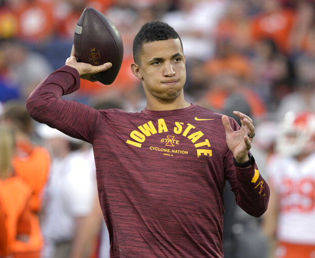 Iowa State running game coordinator Nate Scheelhaase throws as players warm up before the Cheez-It Bowl NCAA college football game against Clemson, Wednesday, Dec. 29, 2021, in Orlando, Fla.
