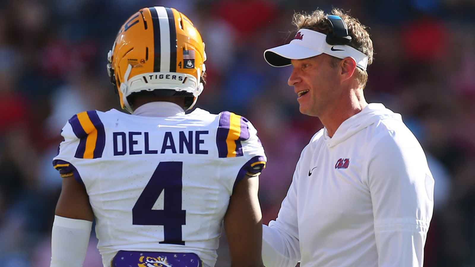 Mississippi Rebels head coach Lane Kiffin talks with LSU Tigers cornerback Mansoor Delane (4) during the second quarter at Vaught-Hemingway Stadium.