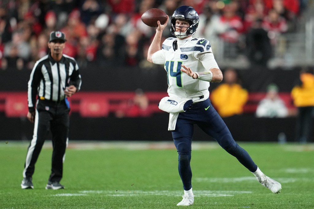Seattle Seahawks quarterback Sam Darnold (14) drops back to pass against the San Francisco 49ers during the second half at Levi's Stadium. 