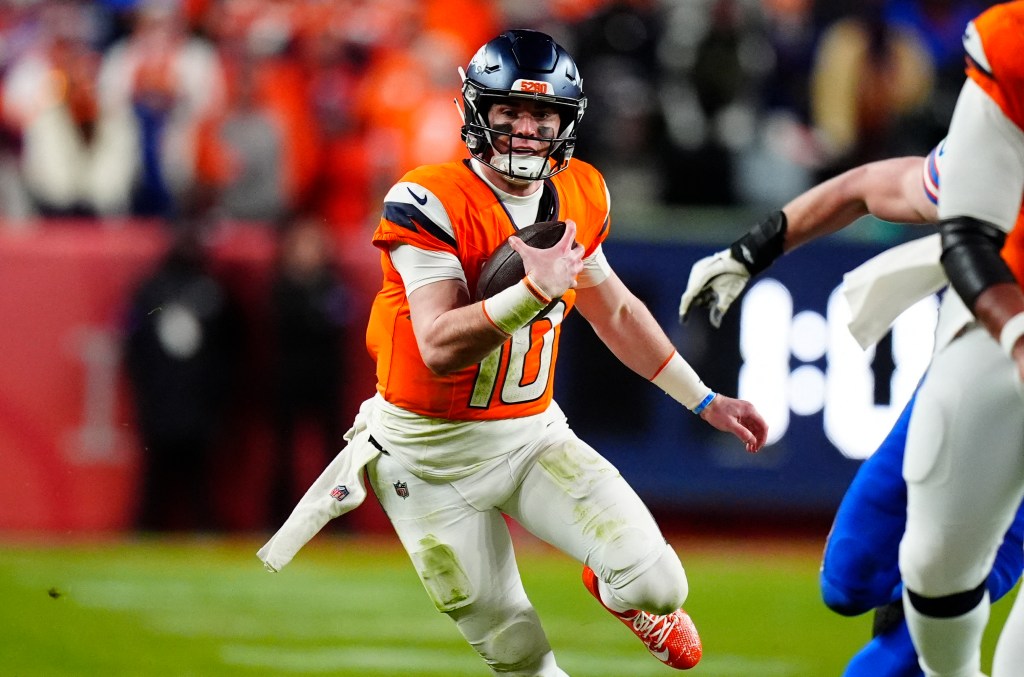Denver Broncos quarterback Bo Nix (10) runs during the fourth quarter of an AFC Divisional Round playoff game against the Buffalo Bills at Empower Field at Mile High.