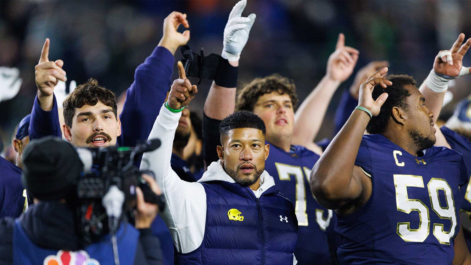 Notre Dame head coach Marcus Freeman celebrates with his players after winning a NCAA football game 70-7 against Syracuse at Notre Dame Stadium on Saturday, Nov. 22, 2025, in South Bend.