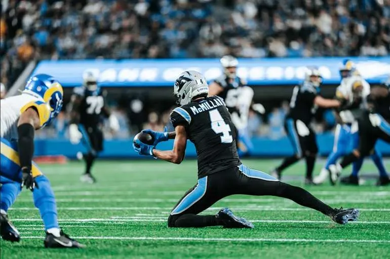 Tetairoa McMillan reels in a catch against the Rams on Saturday
