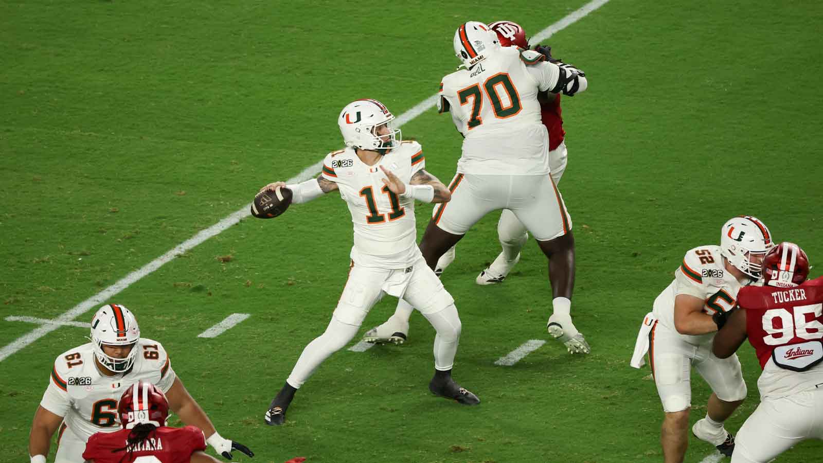 Miami Hurricanes quarterback Carson Beck (11) passes the ball against the Indiana Hoosiers in the second quarter during the College Football Playoff National Championship game at Hard Rock Stadium.