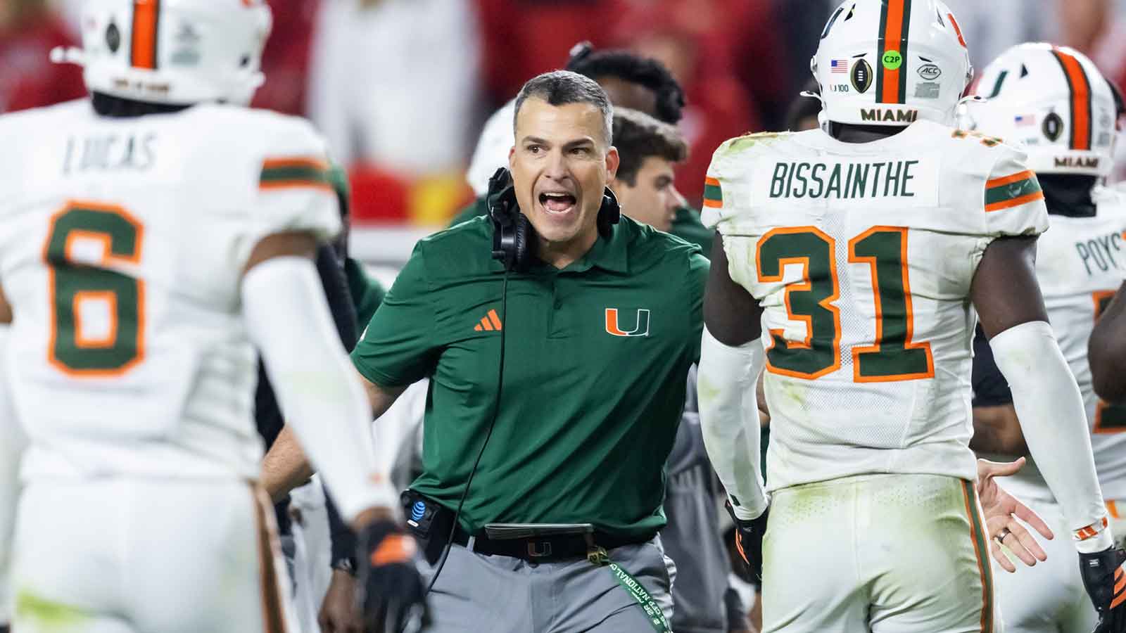 Miami Hurricanes head coach Mario Cristobal with linebacker Wesley Bissainthe (31) against the Indiana Hoosiers during the College Football Playoff National Championship game at Hard Rock Stadium. 