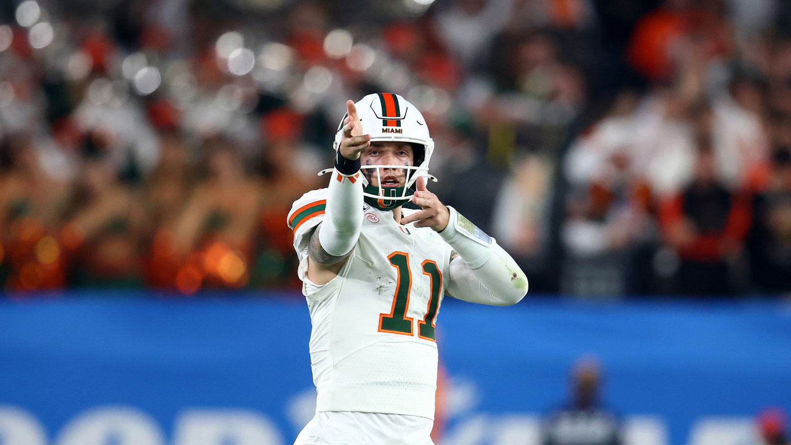 Miami Hurricanes quarterback Carson Beck (11) reacts against the Mississippi Rebels in the second half during the 2026 Fiesta Bowl and semifinal game of the College Football Playoff at State Farm Stadium.