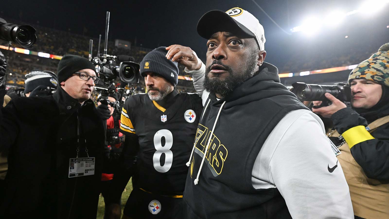 Pittsburgh Steelers head coach Mike Tomlin and quarterback Aaron Rodgers (8) celebrate after defeating the Baltimore Ravens at Acrisure Stadium.
