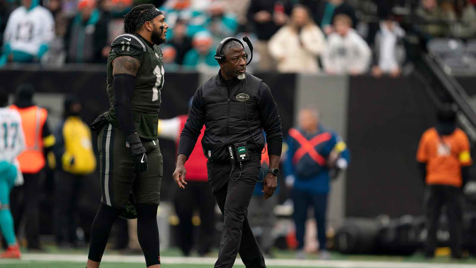 New York Jets head coach Aaron Glenn walks off the field during a week 14 football game between the New York Jets and Miami Dolphins at MetLife Stadium.