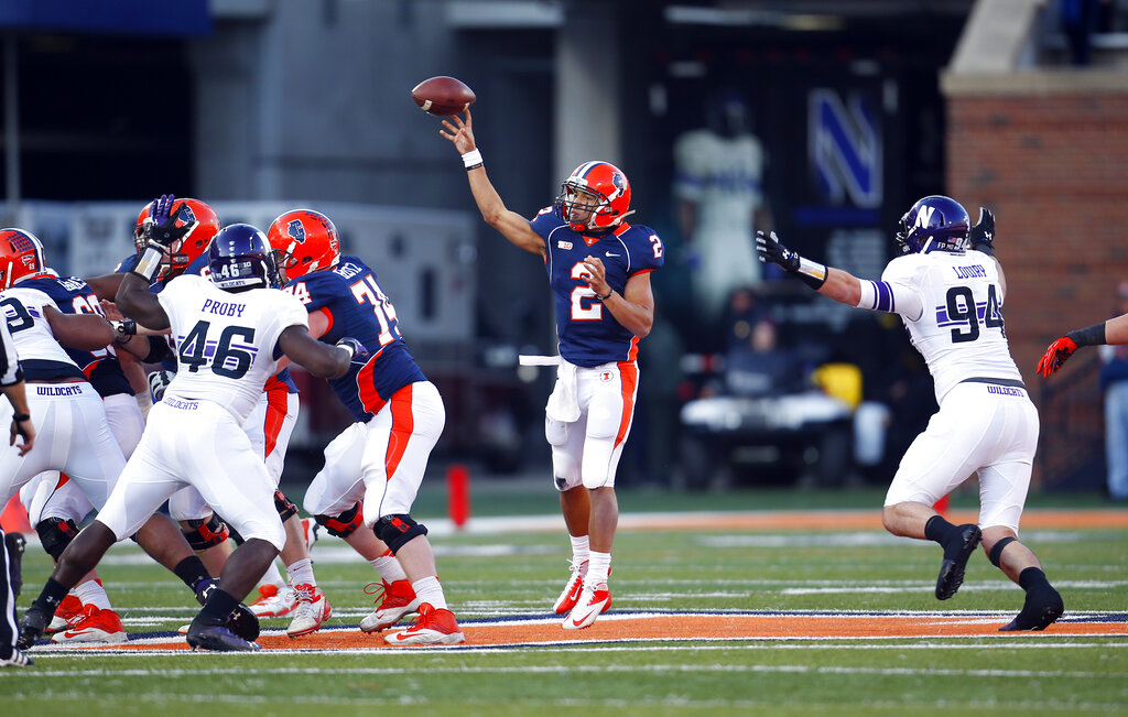 Illinois quarterback Nathan Scheelhaase (2) makes a throw against Northwestern  during the first half of an NCAA college football game on Saturday, Nov. 30, 2013, in Champaign, Ill. 