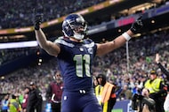 Seattle Seahawks wide receiver Jaxon Smith-Njigba (11) celebrates his touchdown catch during...