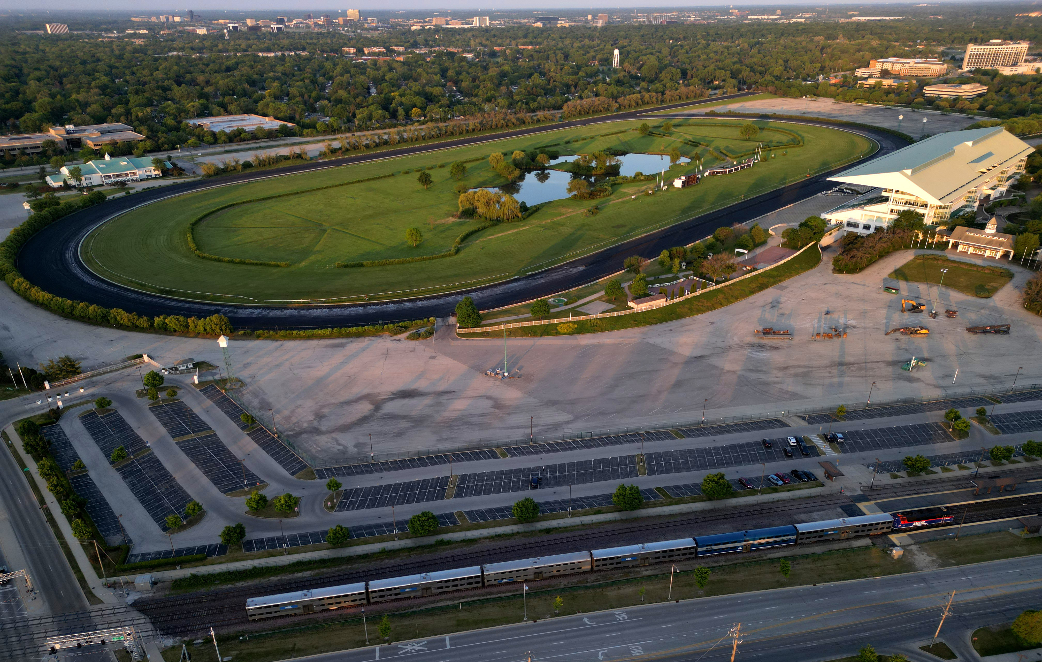 A Metra train passes the former Arlington International Racecourse at...