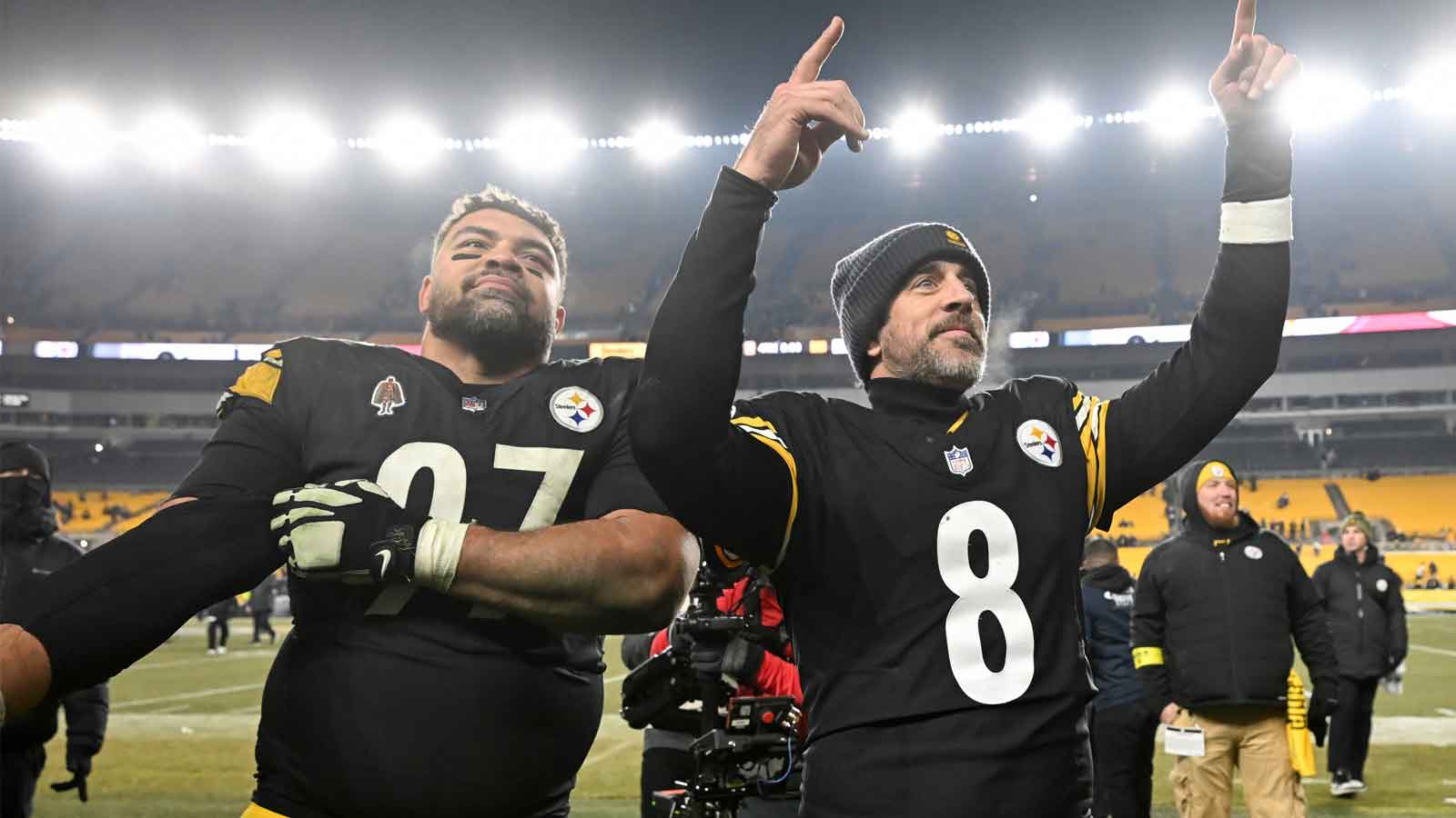 Pittsburgh Steelers quarterback Aaron Rodgers (8) and defensive tackle Cameron Heyward (97) celebrate after defeating the Baltimore Ravens at Acrisure Stadium. 
