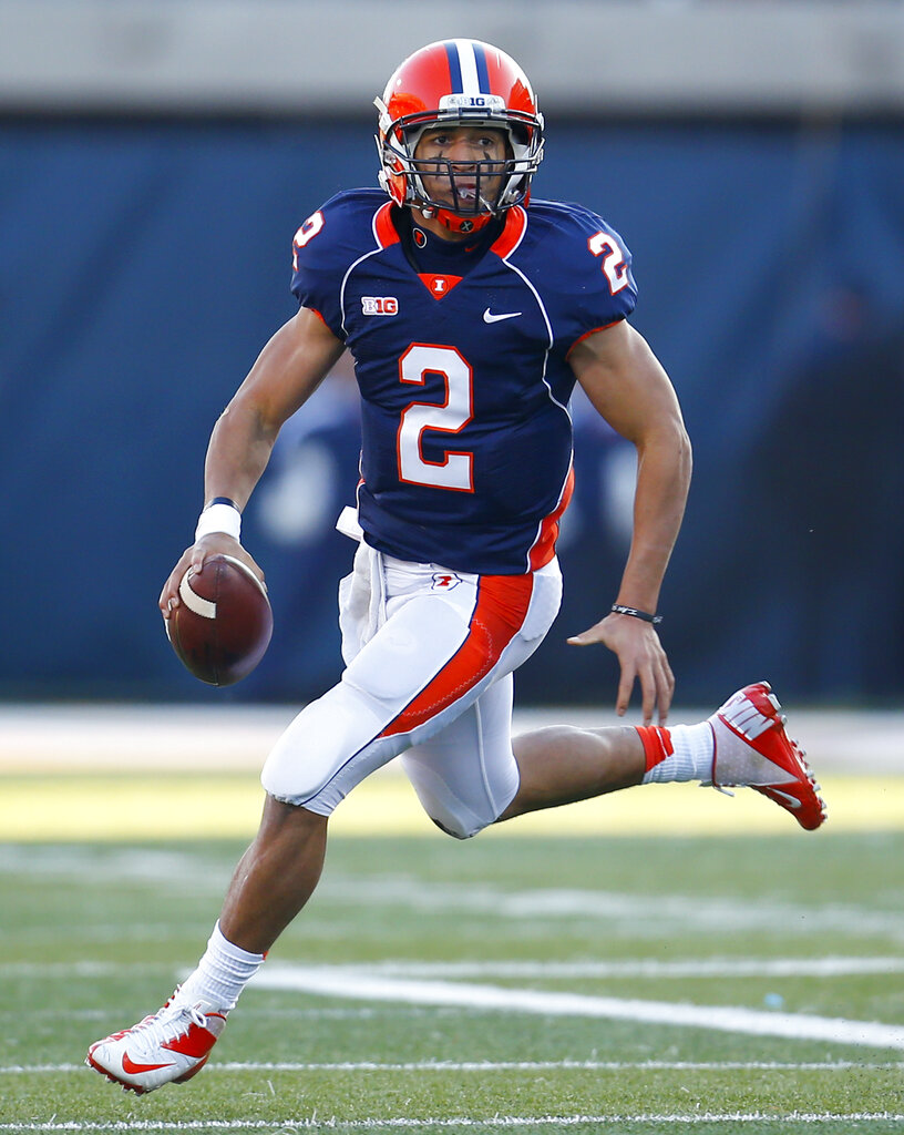 Illinois quarterback Nathan Scheelhaase (2) makes a throw against Northwestern  during the first half of an NCAA college football game on Saturday, Nov. 30, 2013, in Champaign, Ill. 