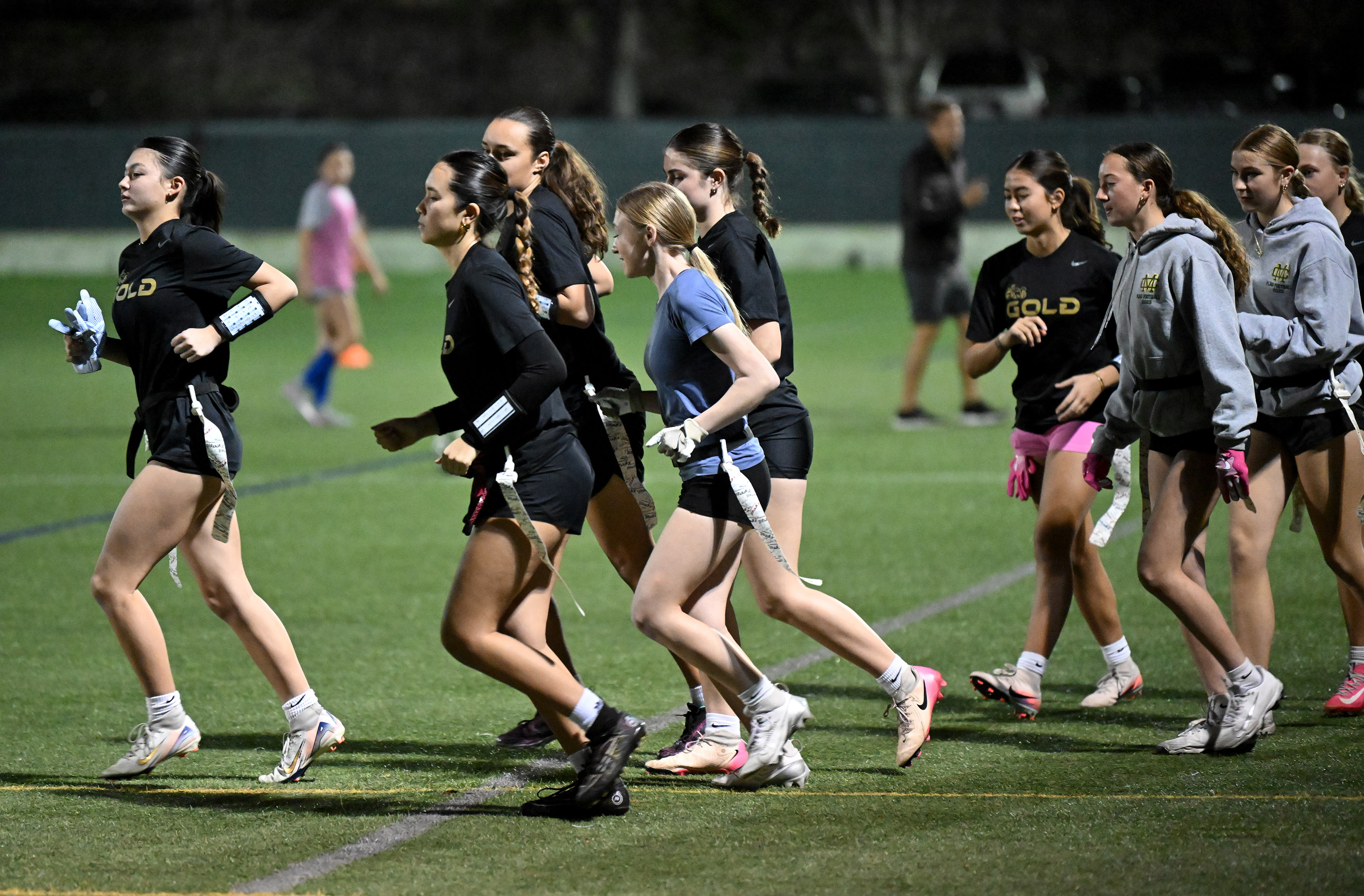High schoolers warm up for BCS Gold club flag football...
