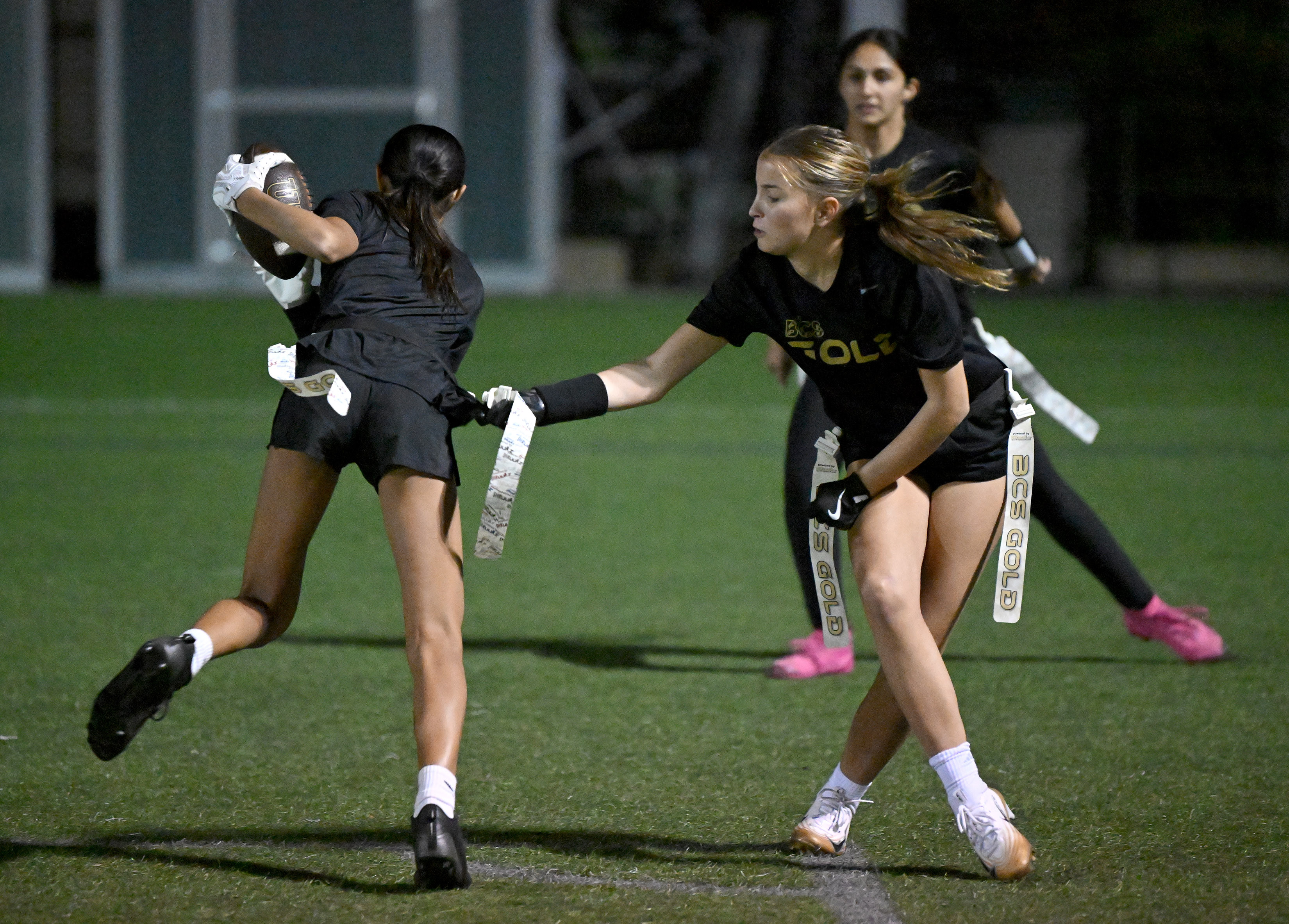 Zara Singh carries the ball as Ava Shay defends during...