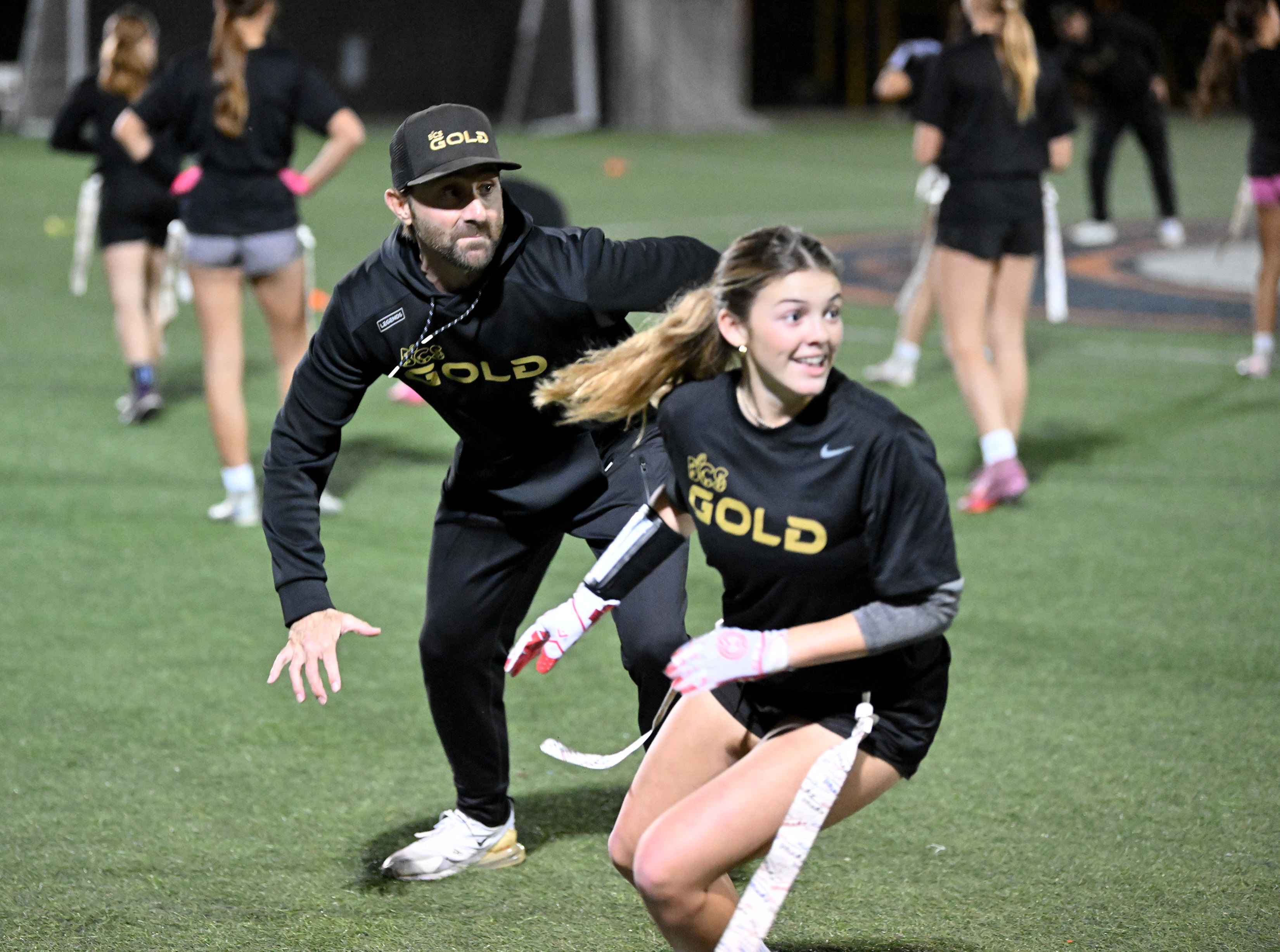 BCS Gold club coach Steve Rivera defends against Giada Krulac...