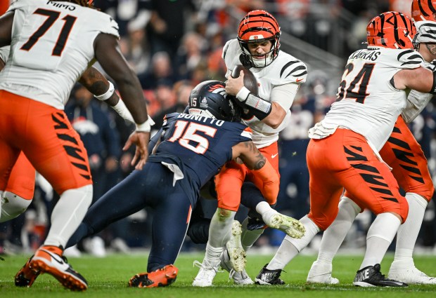 Nik Bonitto (15) of the Denver Broncos sacks Jake Browning (6) of the Cincinnati Bengals during the second quarter at Empower Field at Mile High on Monday, Sept. 29, 2025. (Photo by AAron Ontiveroz/The Denver Post)