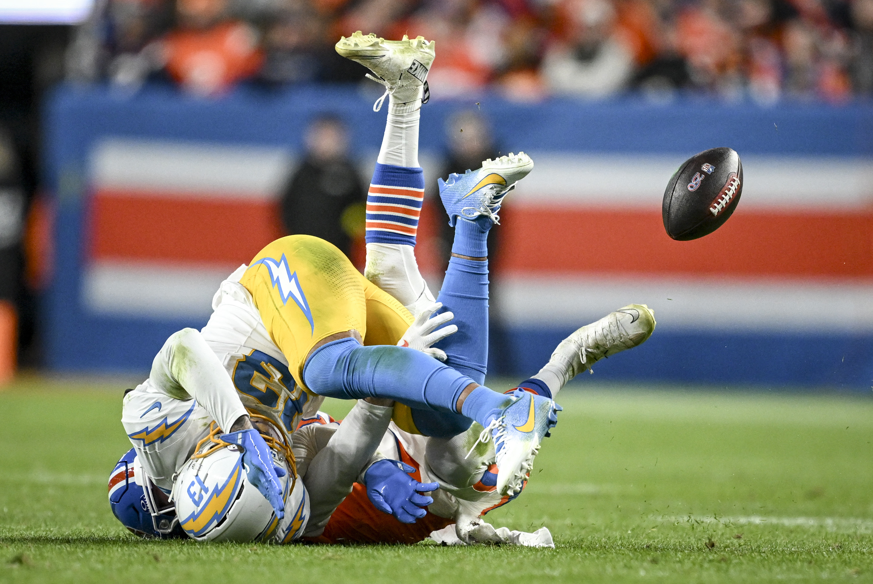 Riley Moss (21) of the Denver Broncos breaks up a...