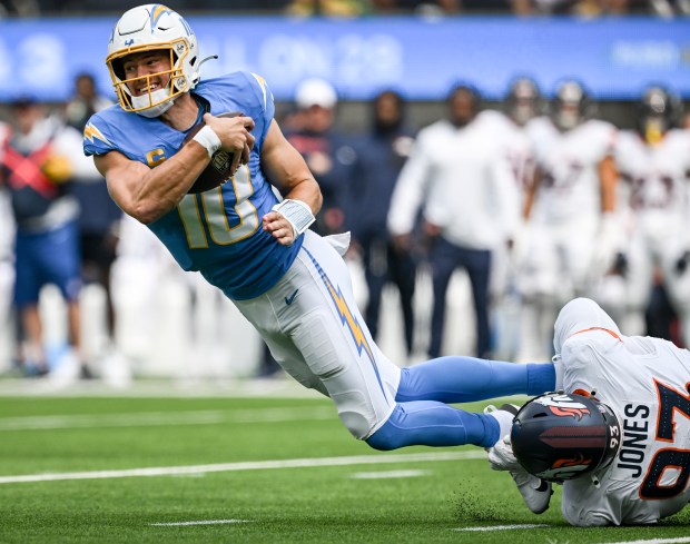 DJ. Jones (93) of the Denver Broncos sacks Justin Herbert (10) of the Los Angeles Chargers during the first quarter at SoFi Stadium in Inglewood, California on Sunday, Sept. 21, 2025. (Photo by AAron Ontiveroz/The Denver Post)