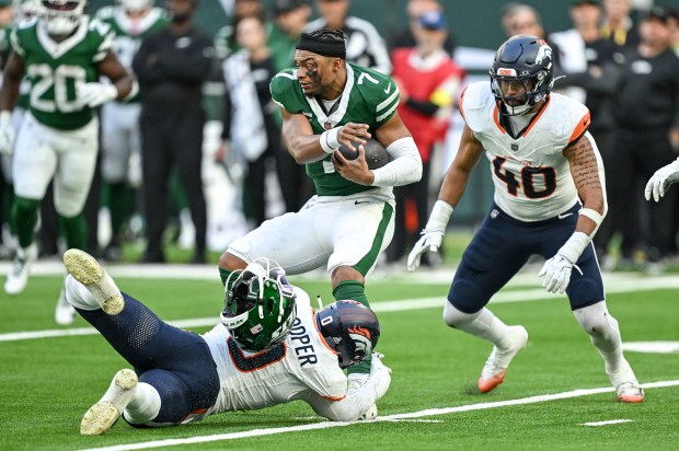 Jonathon Cooper (0) of the Denver Broncos sacks Justin Fields (7) of the New York Jets as Justin Strnad (40) closes in during the third quarter at Tottenham Hotspur Stadium in London on Sunday, Oct. 12, 2025. (Photo by AAron Ontiveroz/The Denver Post)